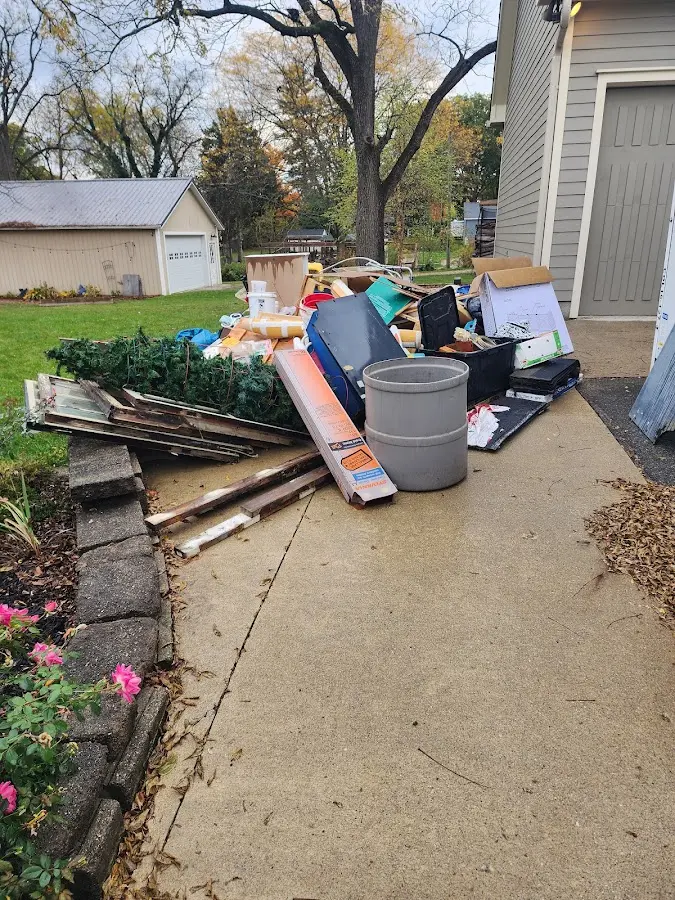 Dumpster being loaded with debris for Residential Dumpster Rental in Orangetree